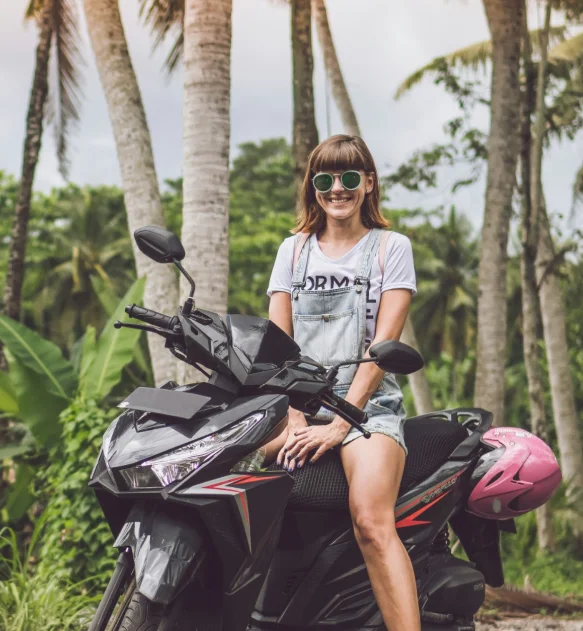 Girl sitting on scooter